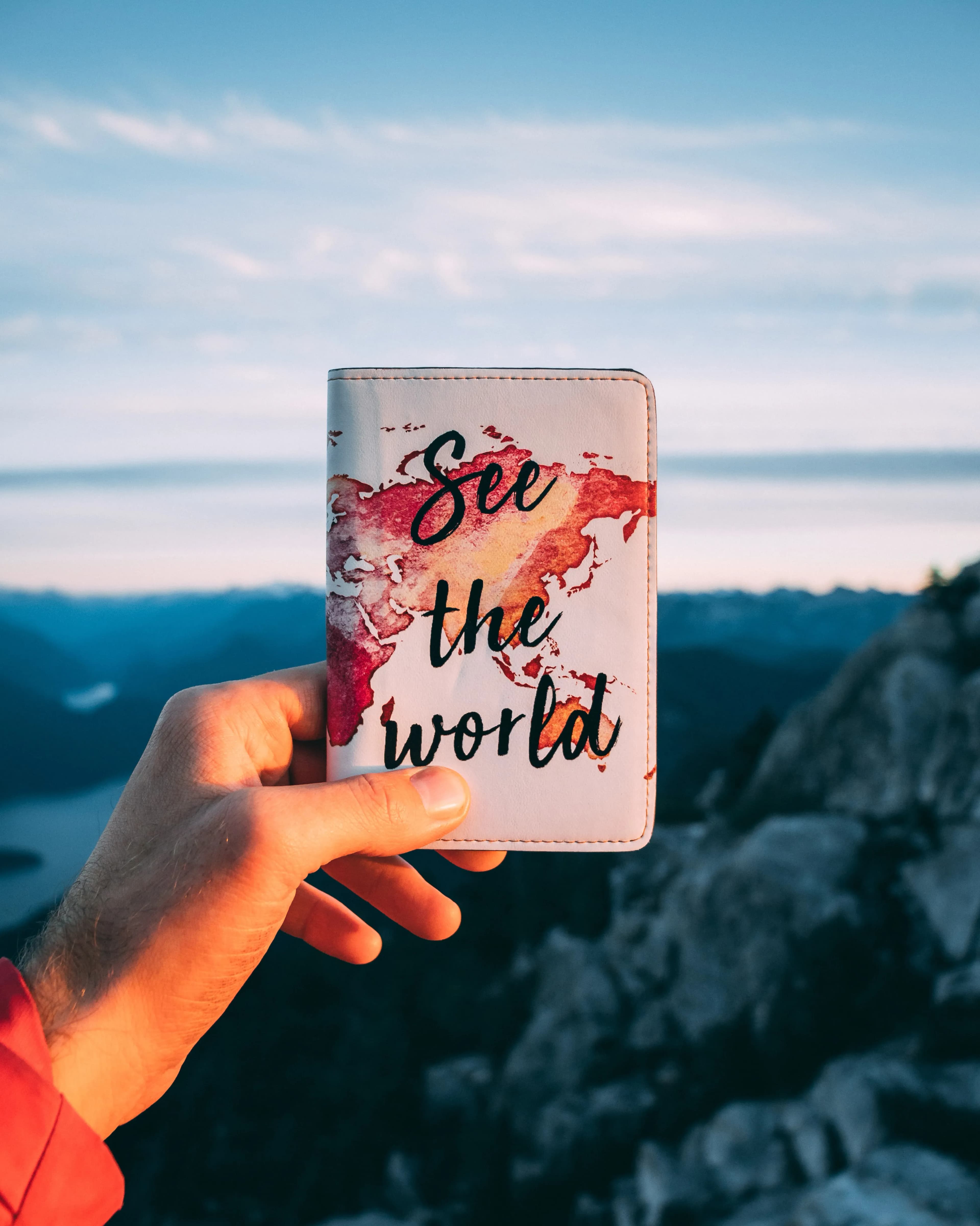 [person holding their passport]